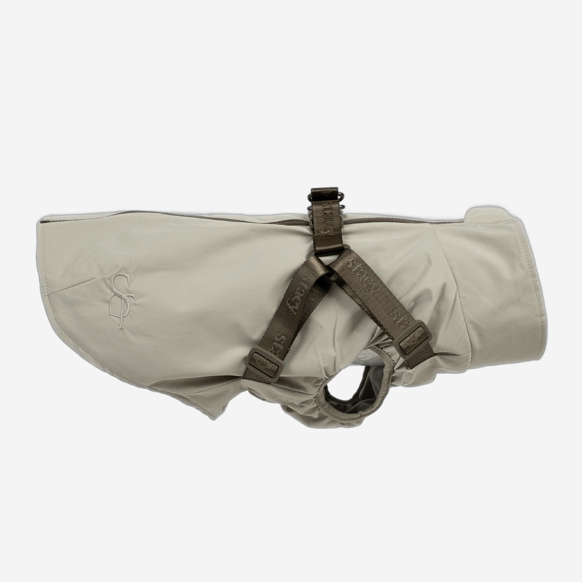 Norma dog rain coat in nature beige with built-in harness, side view
